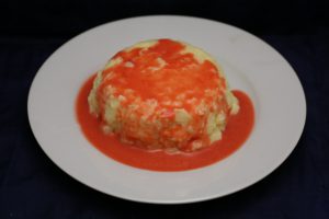 Milchreis-Pudding mit heißer Himbeer-Sauce