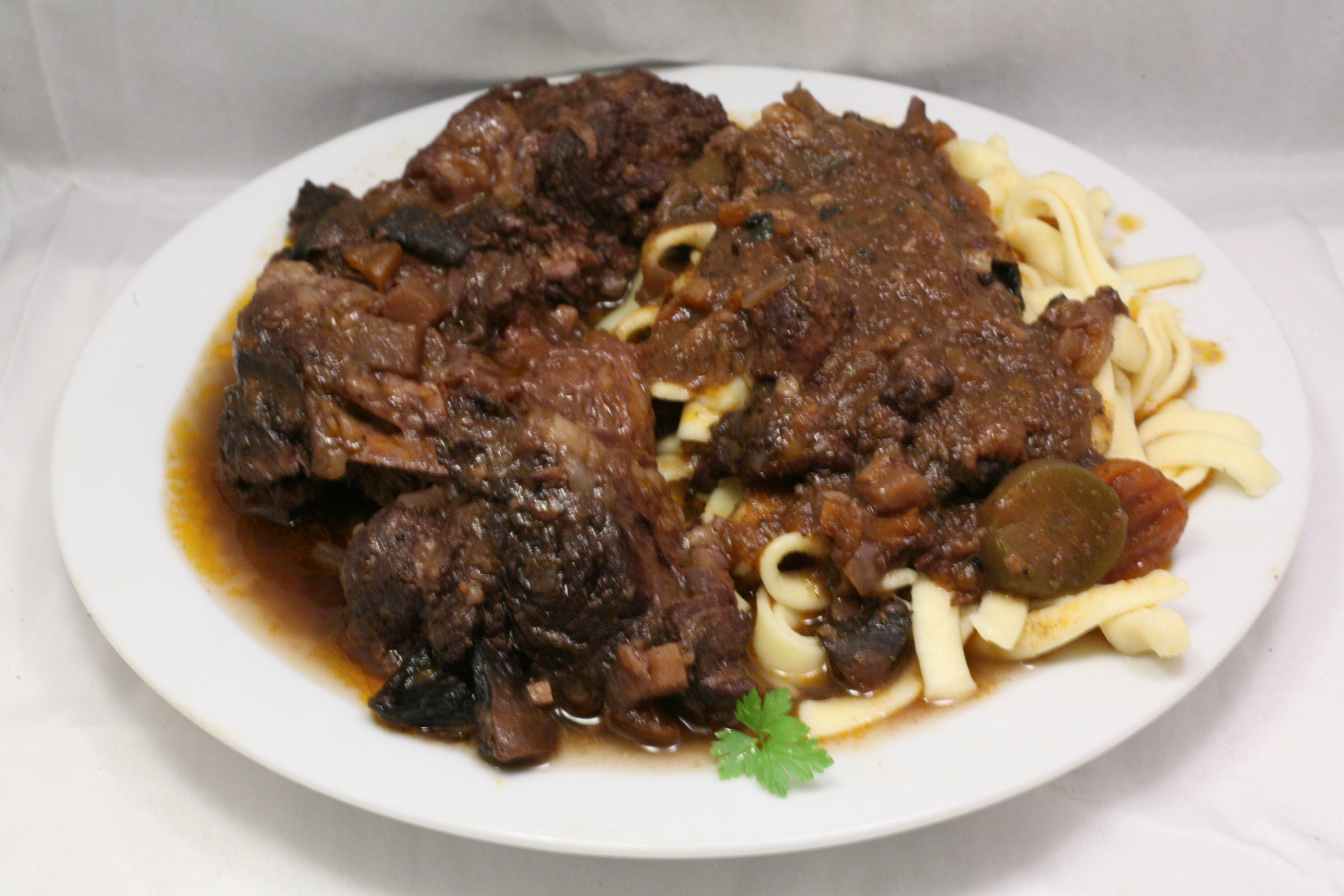 Deutsches Osso Bucco mit frischer Tagliatelle